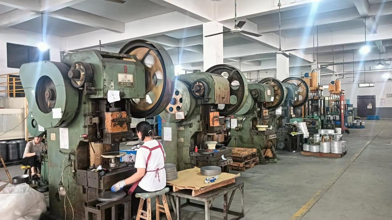 Punching machine for cookware rivet holes and trimming